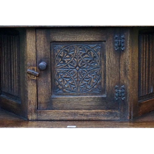 1052 - An old oak court cupboard, 122cm wide x 45cm deep x 143cm high.Payment must be made in advance of co... 