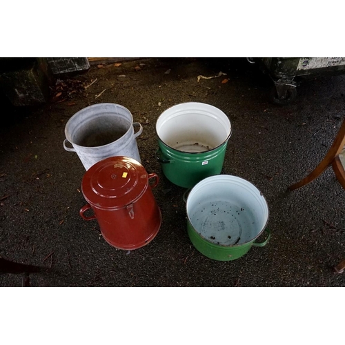 1057 - Three enamel twin handled pots; together with a copper twin handled pot.Payment must be made in adva... 