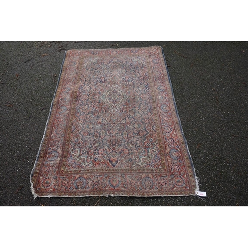 1070 - A Persian rug, having central floral medallion with allover floral design, 189 x 130cm.... 