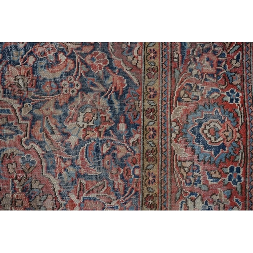 1070 - A Persian rug, having central floral medallion with allover floral design, 189 x 130cm.... 