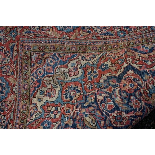 1070 - A Persian rug, having central floral medallion with allover floral design, 189 x 130cm.... 