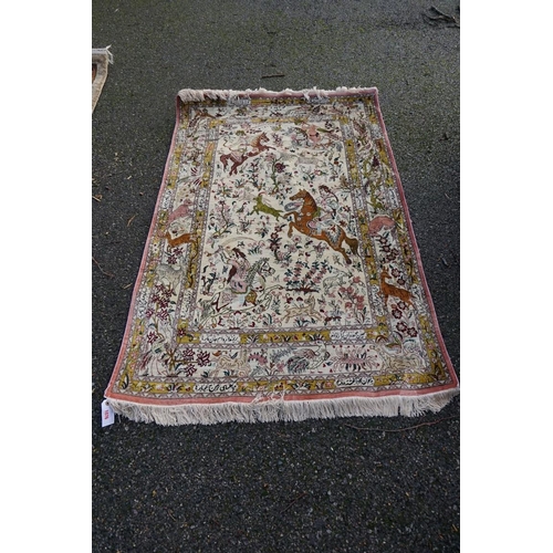 1076 - A Persian rug, having central field decorated with animals and figures, 148 x 100cm.... 