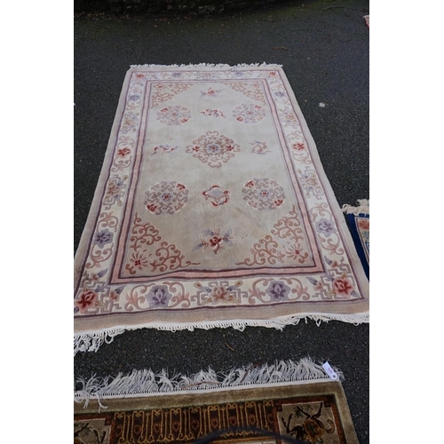 1077 - A Chinese rug, decorated with horse and carriages, 182 x 122cm; together with a pair of small Chines... 