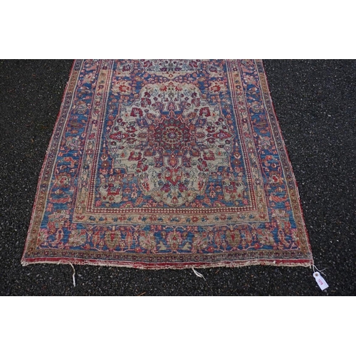 1078 - A Persian rug, having two central medallions with floral borders, 223 x 130cm.