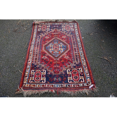 1080 - A small Persian rug, having central medallion with geometric borders, 150 x 112cm.