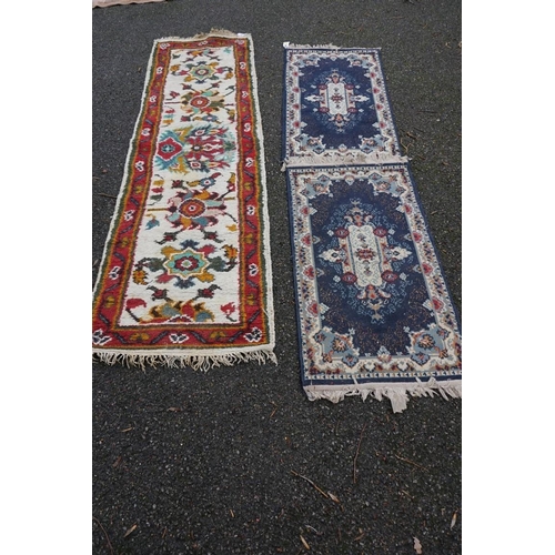 1087 - A Persian runner, 220 x 69cm; together with a pair of small rugs, 108 x 60cm; and a machine made cla... 