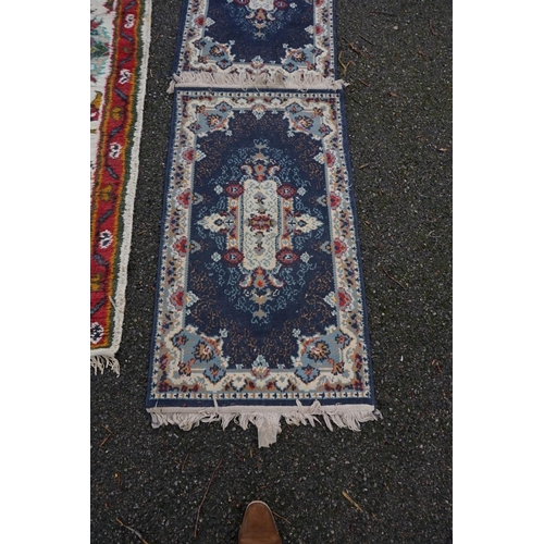 1087 - A Persian runner, 220 x 69cm; together with a pair of small rugs, 108 x 60cm; and a machine made cla... 