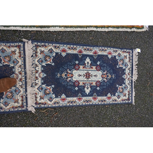 1087 - A Persian runner, 220 x 69cm; together with a pair of small rugs, 108 x 60cm; and a machine made cla... 