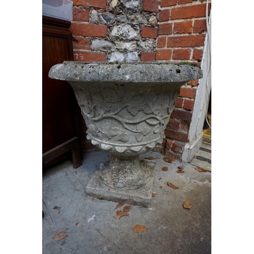 1102 - An old weathered composition stone garden urn, 64cm high x 64cm diameter.