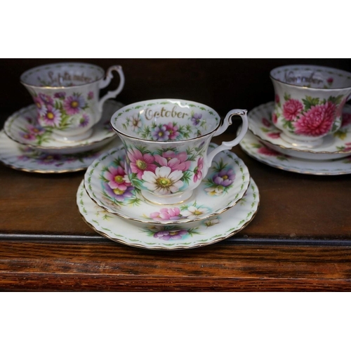 1107 - Twelve Royal Albert 'Flower of the Month' trios, (lacking July cup).... 