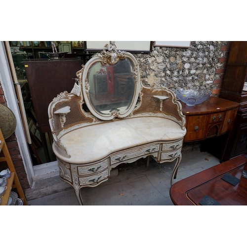 1111 - A Louis XV style grey painted and parcel gilt mirror back dressing table, with marble top and cane d... 