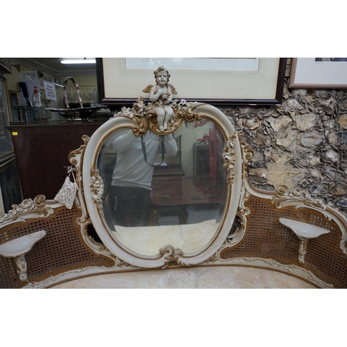 1111 - A Louis XV style grey painted and parcel gilt mirror back dressing table, with marble top and cane d... 