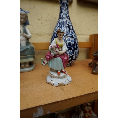 1128 - A small group of pottery and porcelain, to include: a Lladro figure, 21cm high, (chip to little fing... 