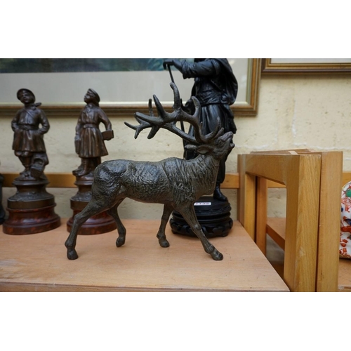 1132 - A small collection of spelter and other patinated metal figures, largest 33cm high.