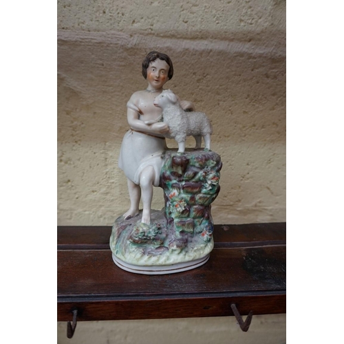 1133 - A small collection of Staffordshire pottery figures, to include: a reproduction spaniel inkwell; and... 