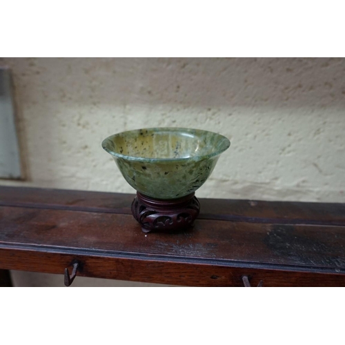 1134 - A mixed group of Chinese ceramics and works of art, to include: a pair of green jade bowls, 10cm dia... 