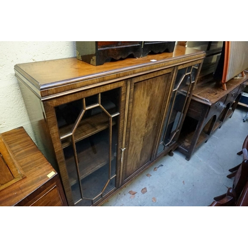 1138 - A 1930s walnut bookcase, 121cm wide.