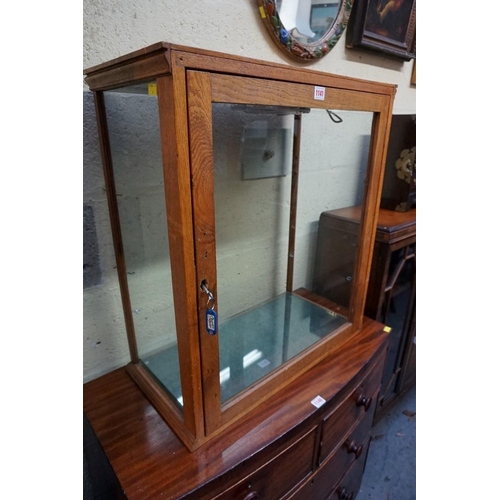 1141 - An oak table top display cabinet, 72cm high x 64.5cm wide x 32.5cm deep. 