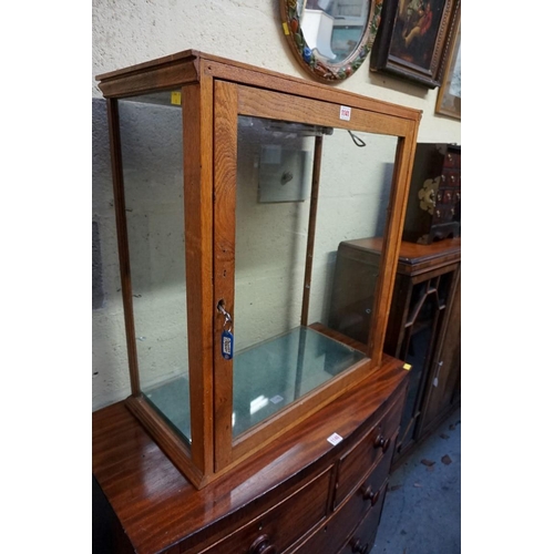 1141 - An oak table top display cabinet, 72cm high x 64.5cm wide x 32.5cm deep. 