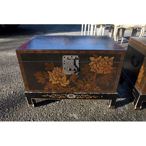 1155 - A small pair of Chinese black lacquered and gilt chests on stands, 61cm wide.