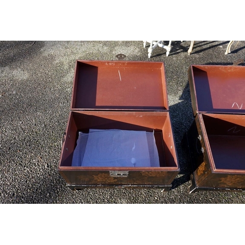 1155 - A small pair of Chinese black lacquered and gilt chests on stands, 61cm wide.