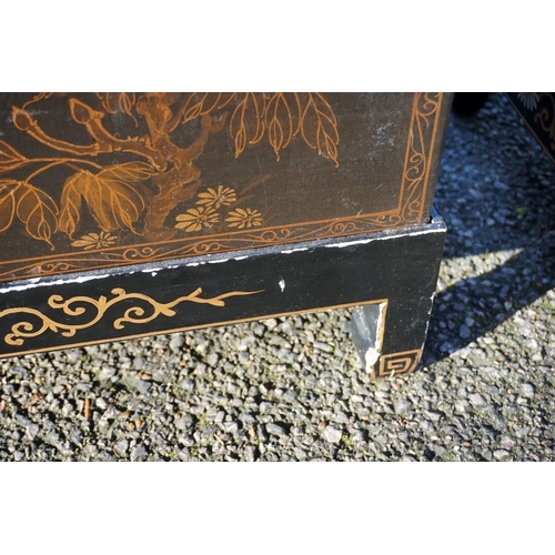 1155 - A small pair of Chinese black lacquered and gilt chests on stands, 61cm wide.