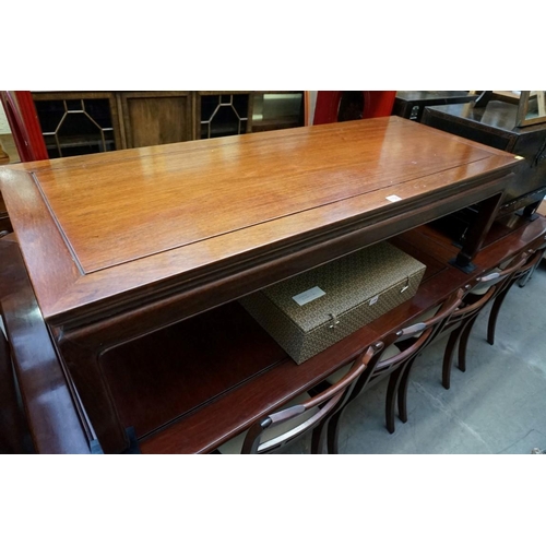 1156 - A Chinese hardwood rectangular low occasional table, 132cm wide. 