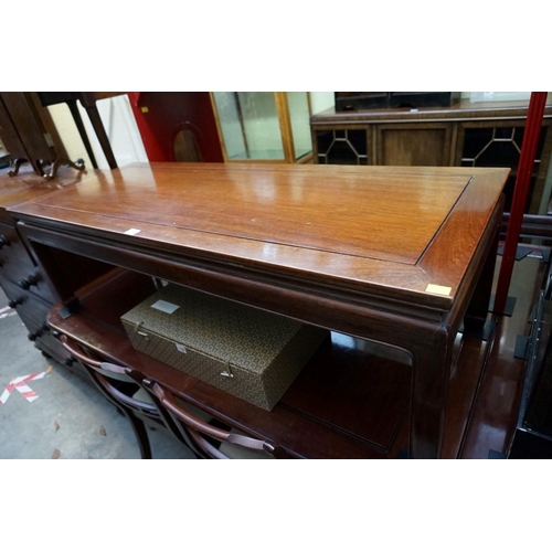 1156 - A Chinese hardwood rectangular low occasional table, 132cm wide. 