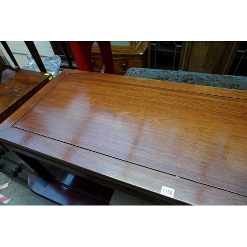 1156 - A Chinese hardwood rectangular low occasional table, 132cm wide. 