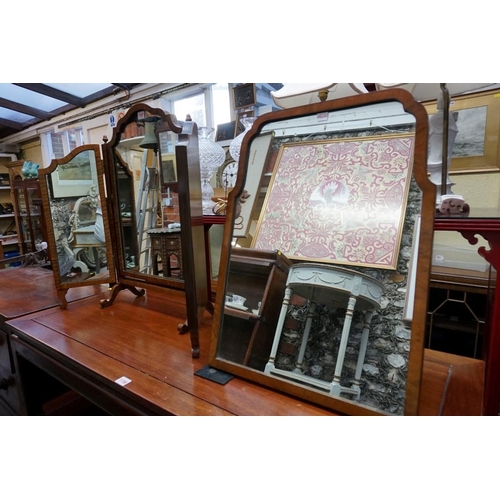 1157 - A 1930s walnut triptych mirror, 68.5cm wide; together with another similar easel back example, 58.5c... 