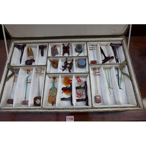 1158 - A cased set of Chinese hardstone musical instruments, 20th century, approx 26, most with wood s... 