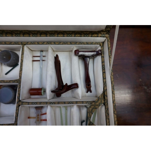 1158 - A cased set of Chinese hardstone musical instruments, 20th century, approx 26, most with wood s... 