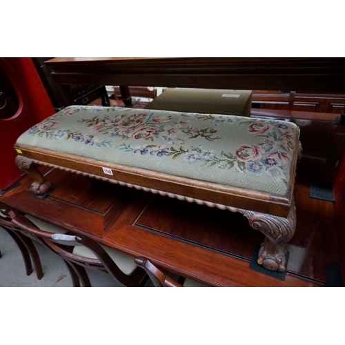 1162 - A 1930s, 18th century style, carved walnut rectangular long low stool, on ball and claw feet, 94cm w... 