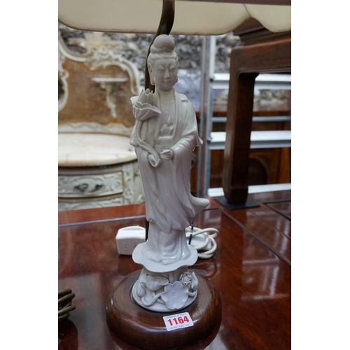 1164 - A pair of Chinese blanc de chine Guanyin figural table lamps, the figures 31.5cm high.... 