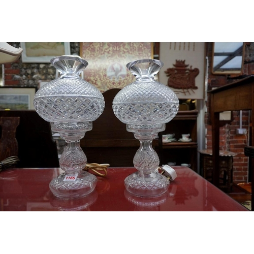 1165 - A pair of Waterford cut glass table lamps and shades, 35cm high, (chip to top rim of one).... 