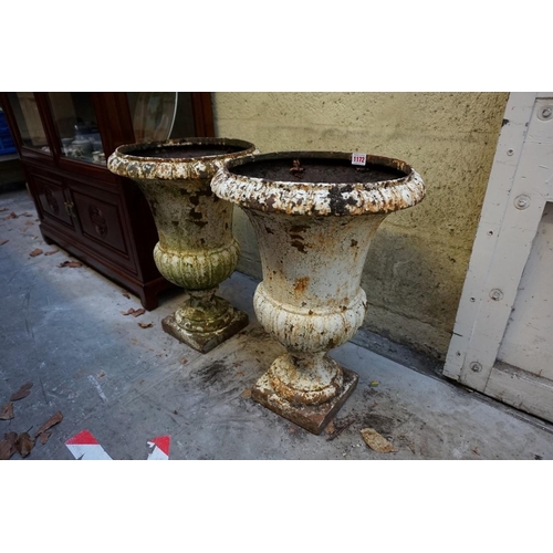 1172 - A pair of Victorian white painted cast iron campana urns, 54cm high.