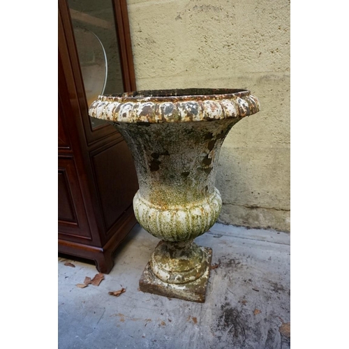 1172 - A pair of Victorian white painted cast iron campana urns, 54cm high.