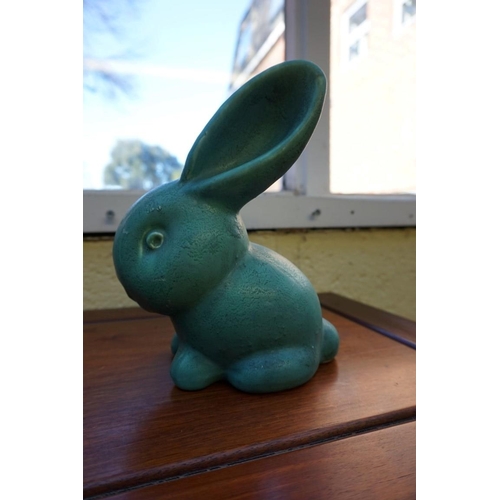 1174 - A graduated set of three Denby rabbits, largest 27cm high, (glaze flake to largest).... 