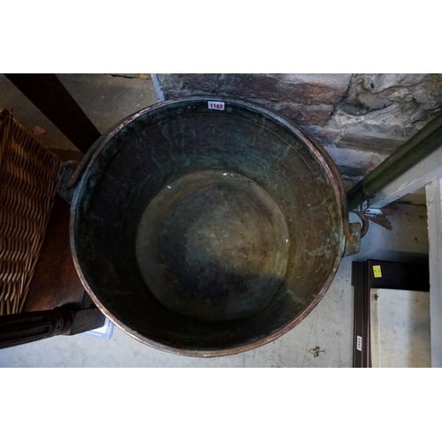 1182 - A large Victorian copper swing handled cauldron, with steel band to rim, 48cm diameter. ... 