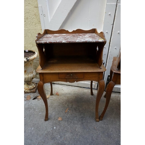 1184 - A pair of Continental oak and marble top bedside tables, 53.5cm wide.