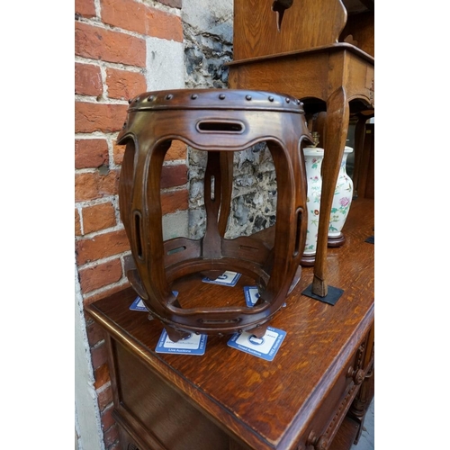 1185 - A Chinese hardwood barrel form jardiniere stand or stool, 46cm high.