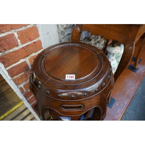 1185 - A Chinese hardwood barrel form jardiniere stand or stool, 46cm high.