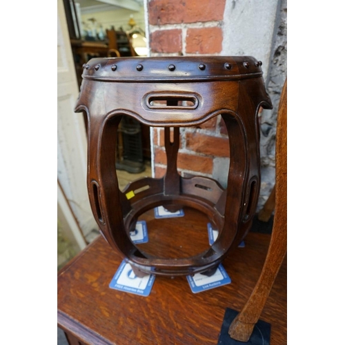 1185 - A Chinese hardwood barrel form jardiniere stand or stool, 46cm high.