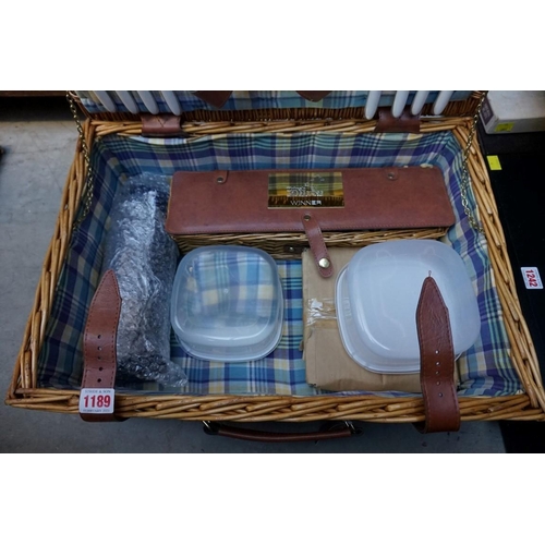 1189 - A Brookes four person wicker picnic hamper. 