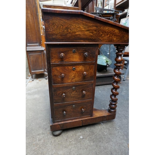 1203 - A Victorian rosewood Davenport, 52.5cm wide. 