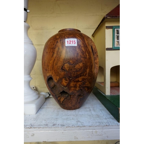 1215 - A turned burr oak vase, 27cm high. 