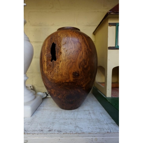 1215 - A turned burr oak vase, 27cm high. 