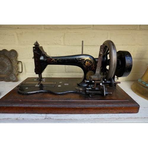 1218 - A Frister & Rossmann sewing machine, in walnut case.