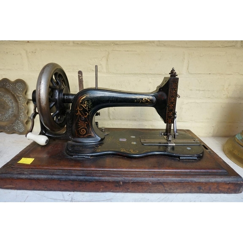 1218 - A Frister & Rossmann sewing machine, in walnut case.