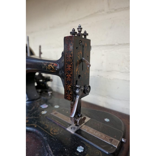 1218 - A Frister & Rossmann sewing machine, in walnut case.